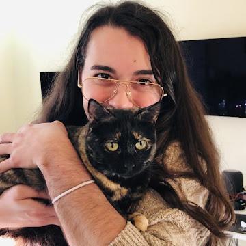 Dominic Minischetti III holding a tortoiseshell cat